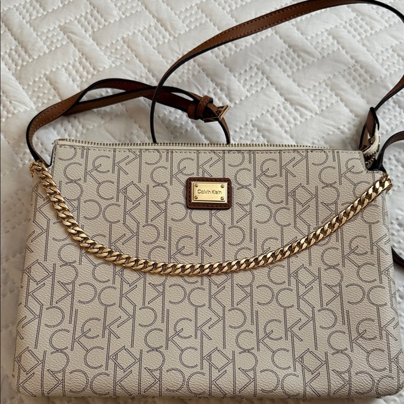 Calvin Klein Handbags - Calvin Klein Cream Monogram Chain Crossbody with Brown Strap